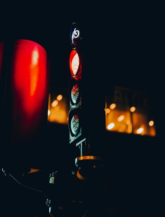 stop light at night with street lights in background