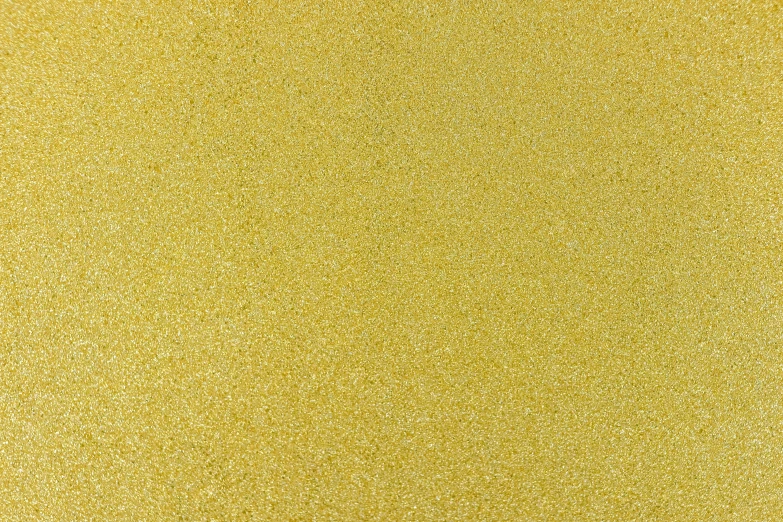 a piece of yellow paper with glitter