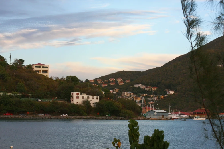 a view from a lake looking down at the mountains