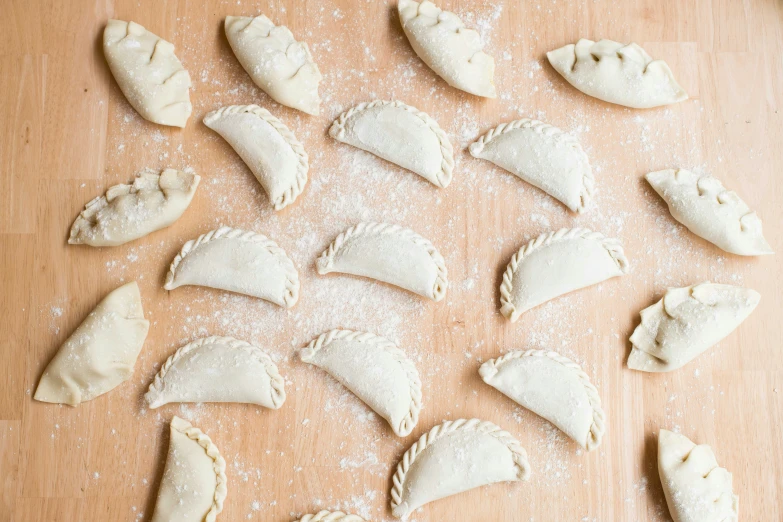 dumplings on a table are filled with flour