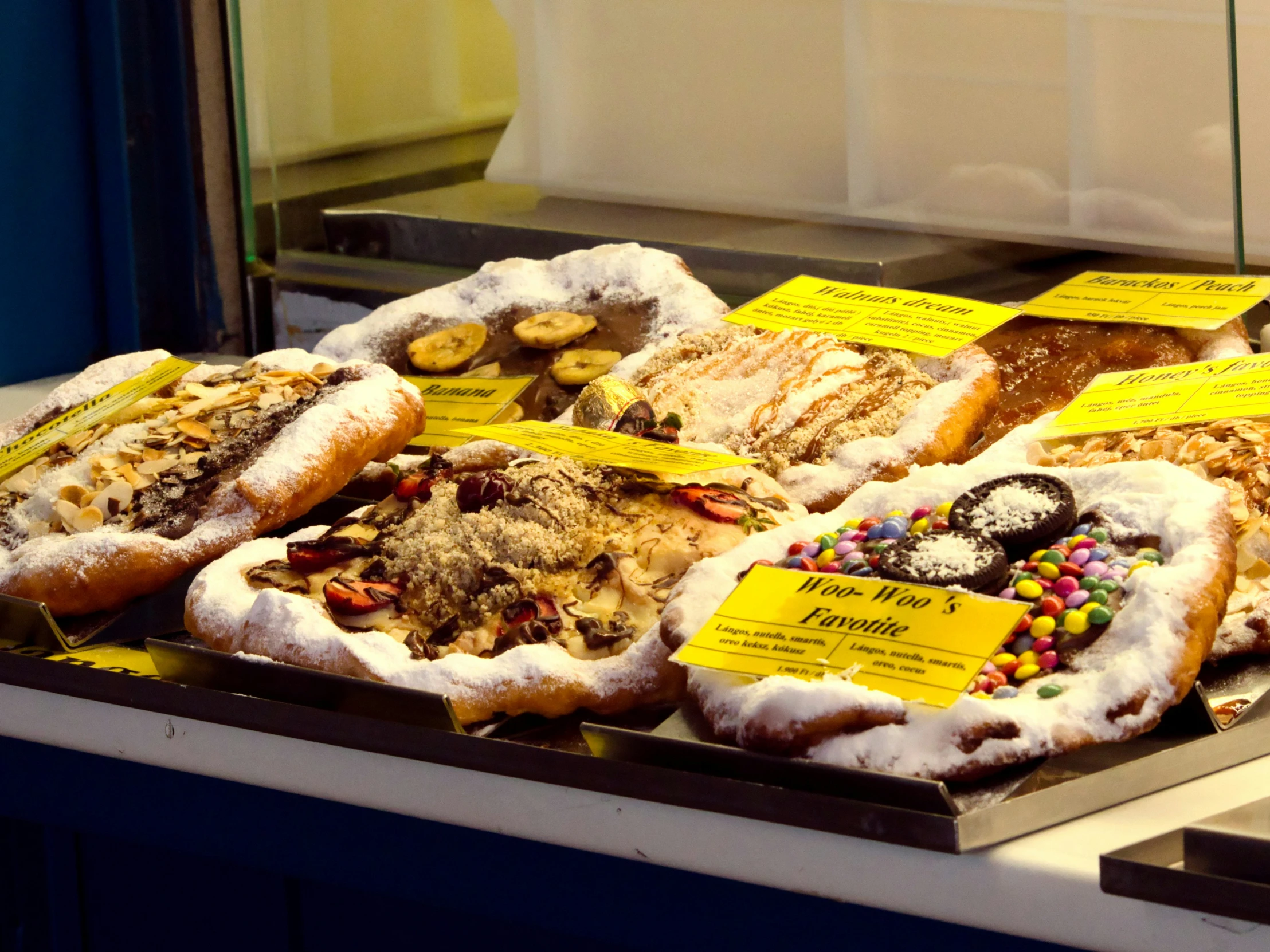 the deli is filled with various types of doughnuts