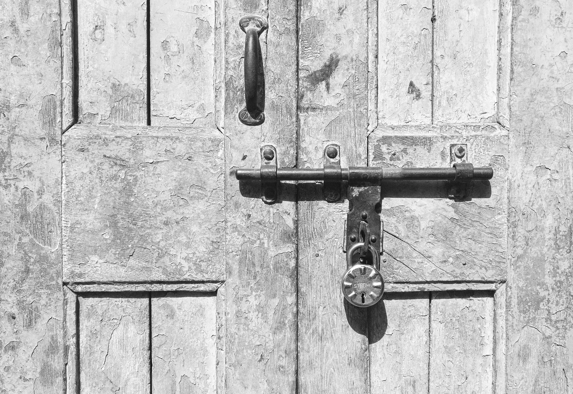 a black and white po of the door of an old building