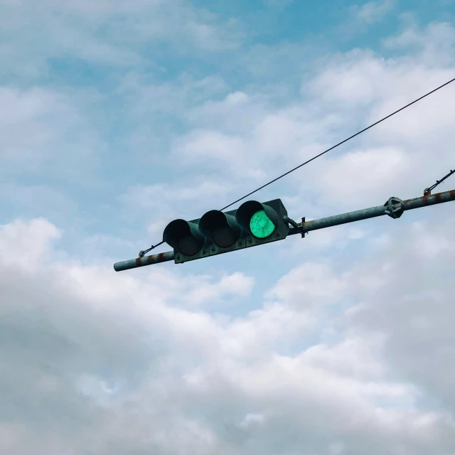 a traffic light is attached to a power line