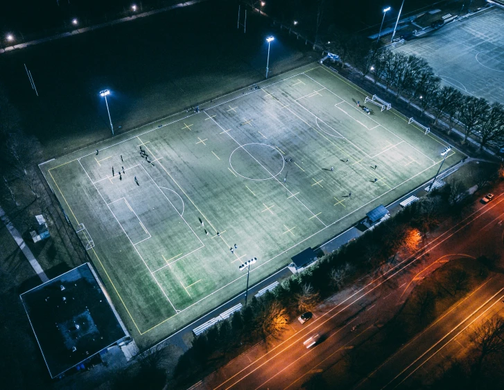 a tennis court at night from above