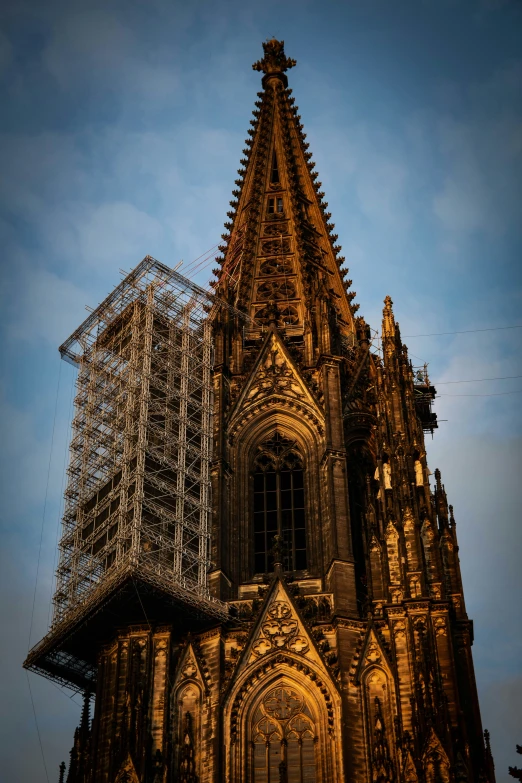 an intricate architectural structure with scaffolding above it