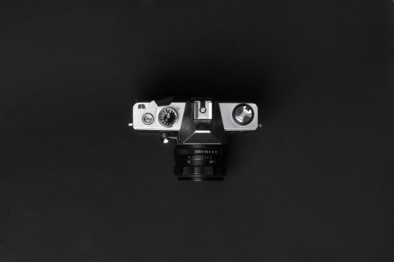 a close up of an analog camera with a metal back