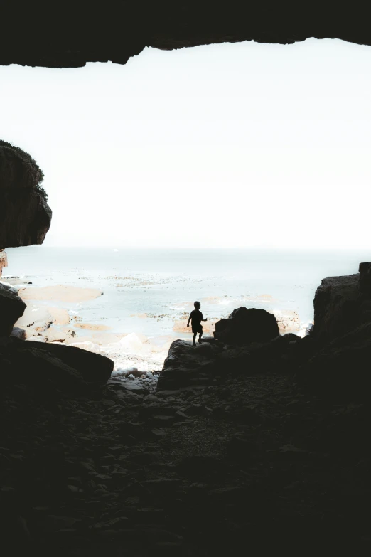 the view out of a cave into the ocean