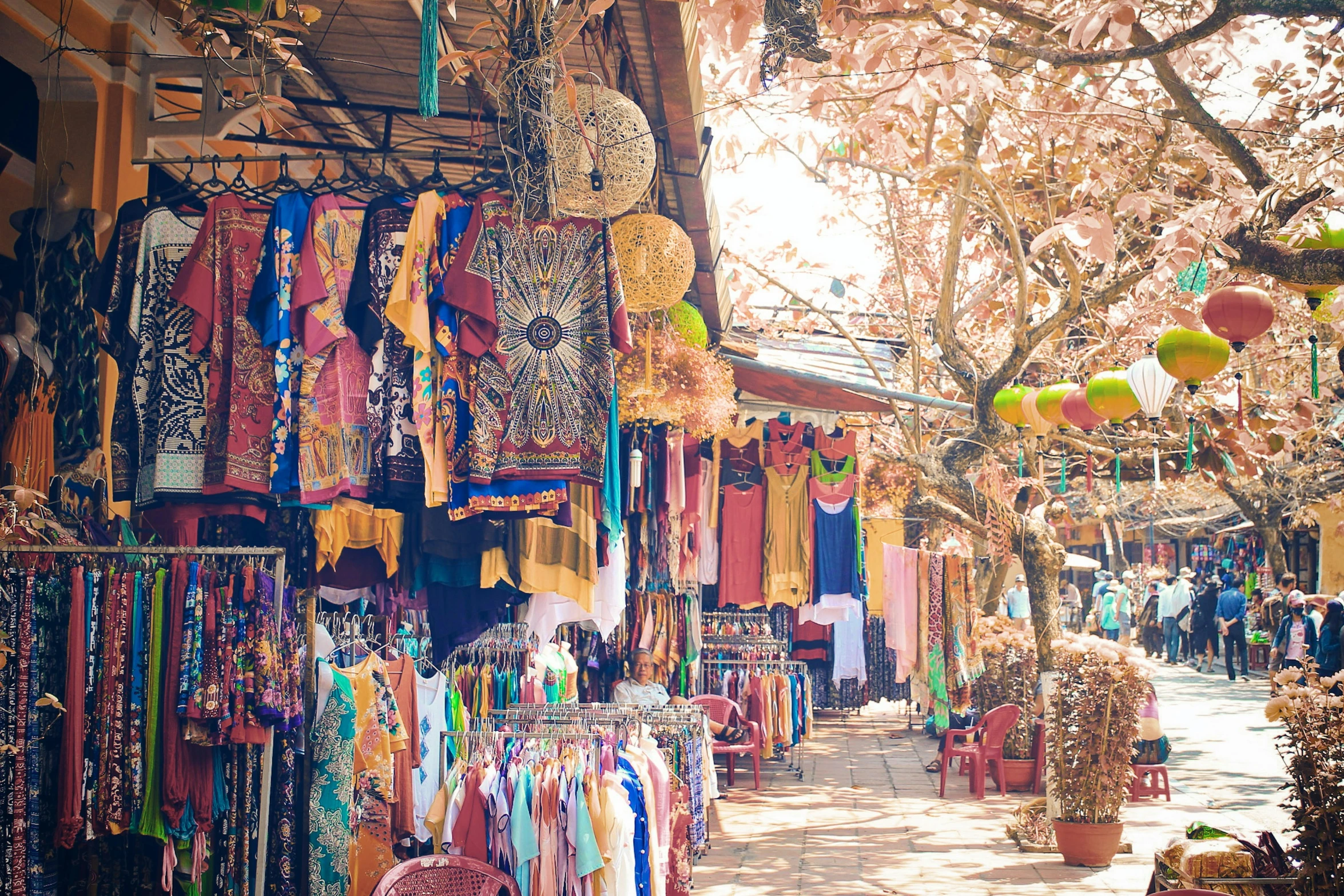 an outdoor market with some colorful decorations and stuff