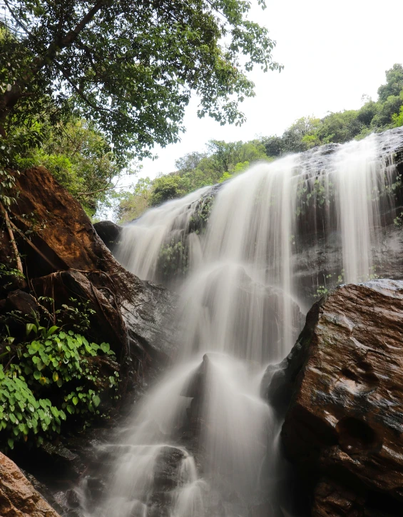 a waterfall with lots of water flowing into it