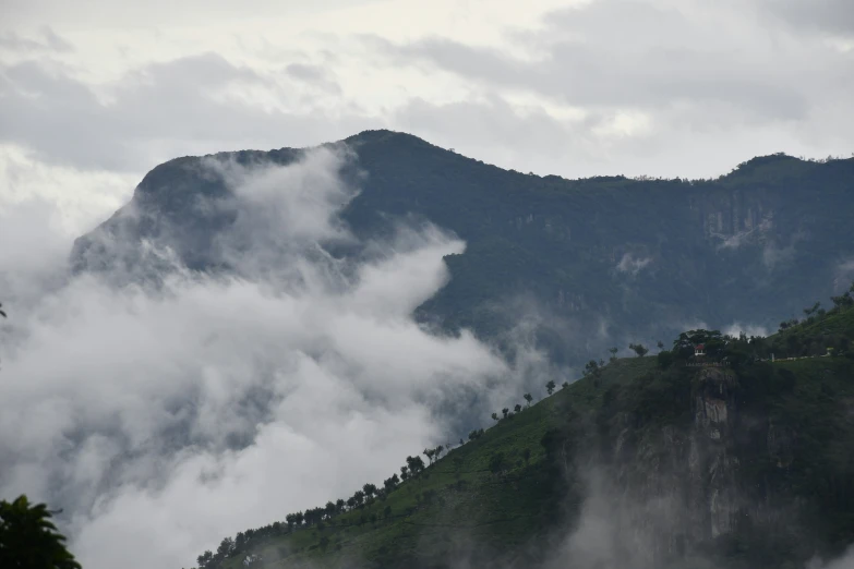 the view of a mountain, with low lying clouds