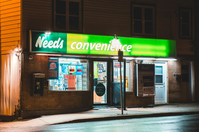 a storefront with neon signs and street lights