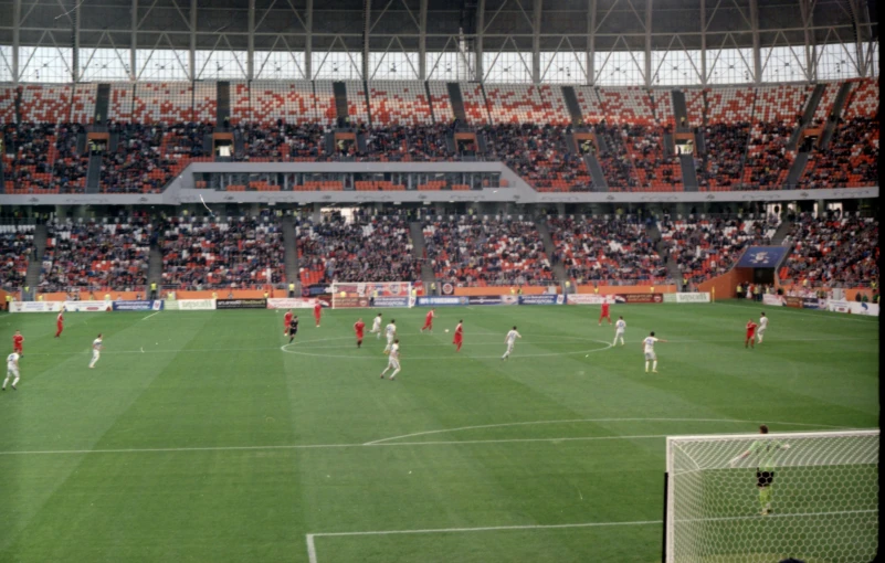 a view of a soccer game with a group of people playing