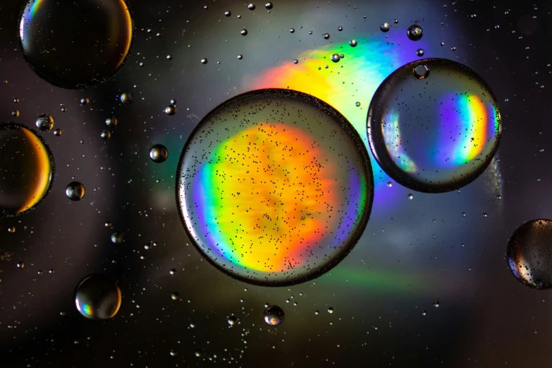 a painting of rainbow and silver bubbles