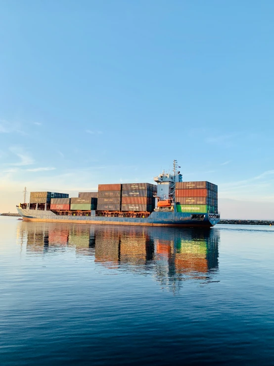 a ship on the water with lots of cargo containers