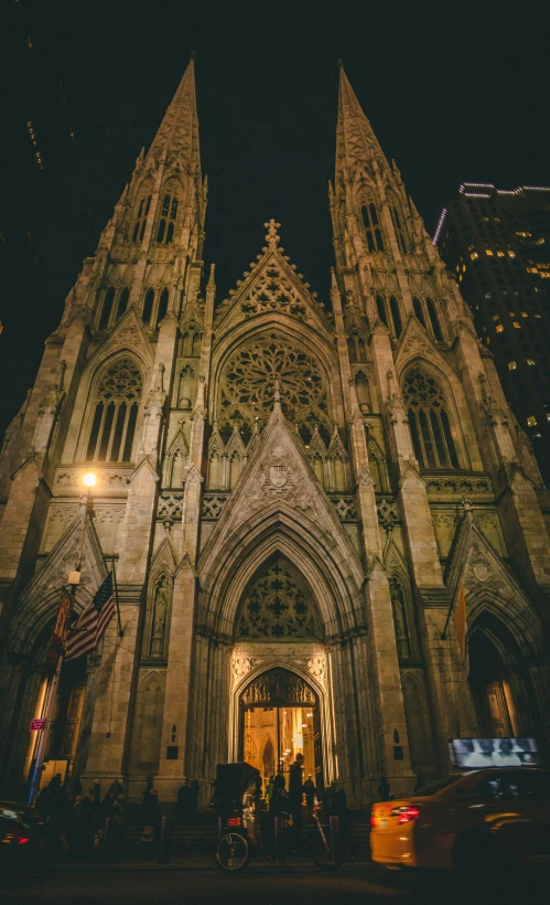 a cathedral lit up in the night by some bright lights