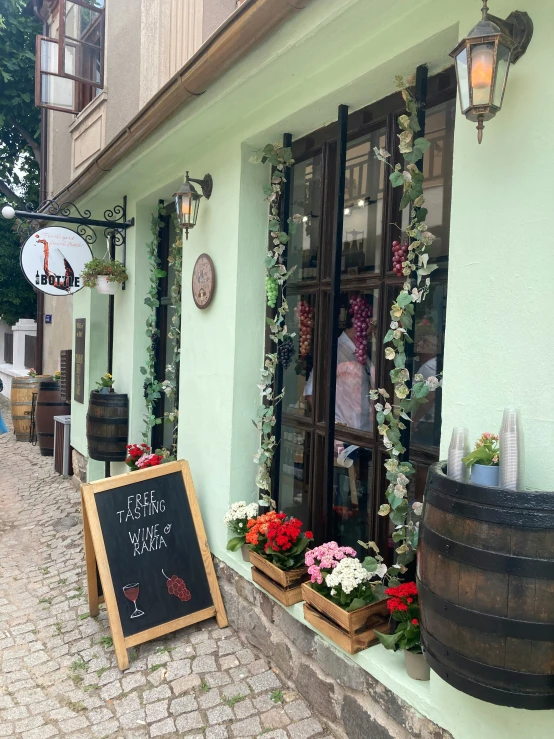 a cafe sign on the outside of it's store