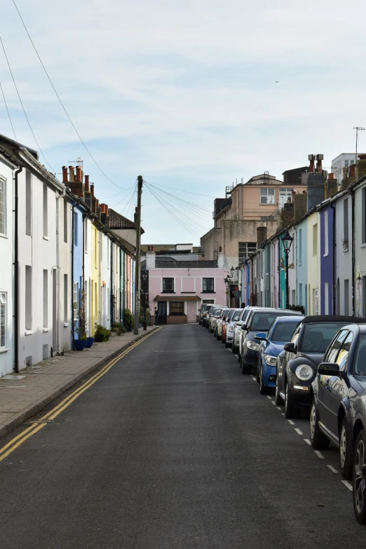 several cars parked on both sides of the street