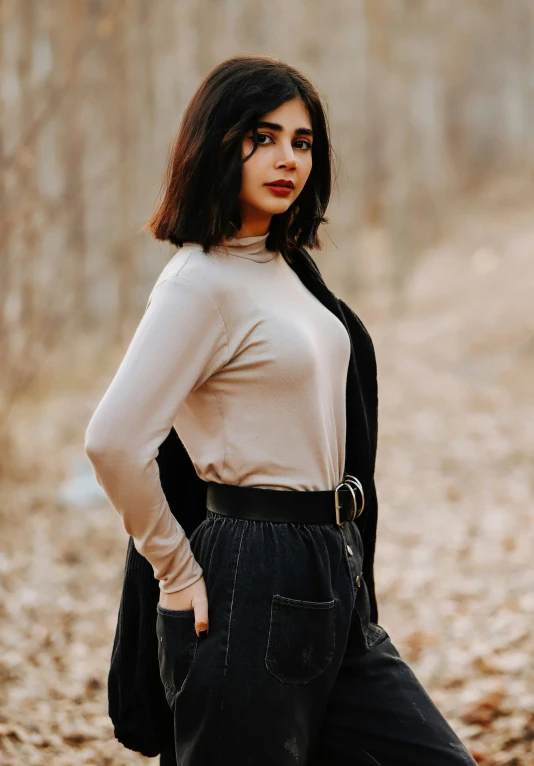 a woman with a black scarf and a sweater