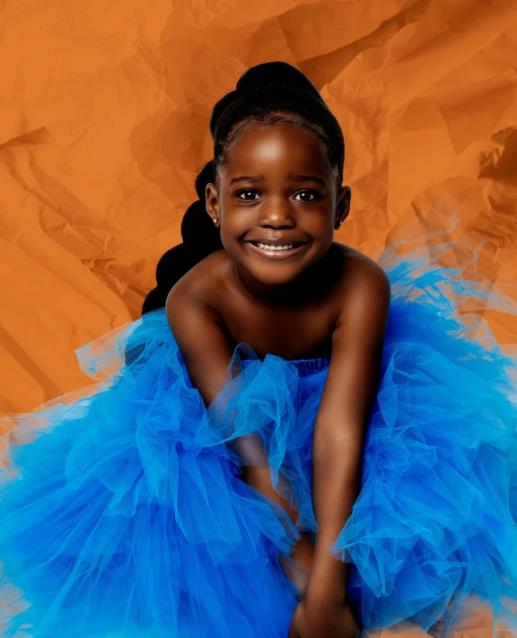 a very cute little girl wearing a blue dress