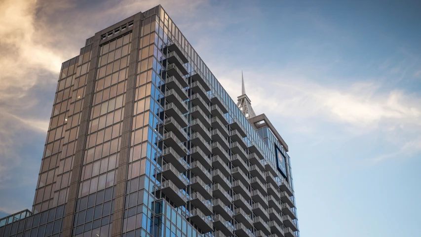 a building against a cloudy sky and clouds