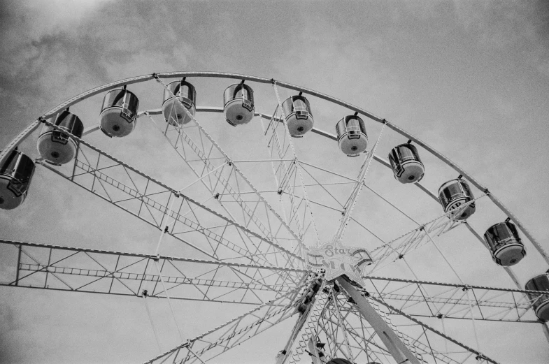 a black and white picture of a ferris wheel