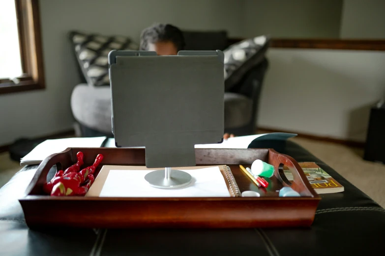 a tablet with an ipad on it sitting on top of a tray