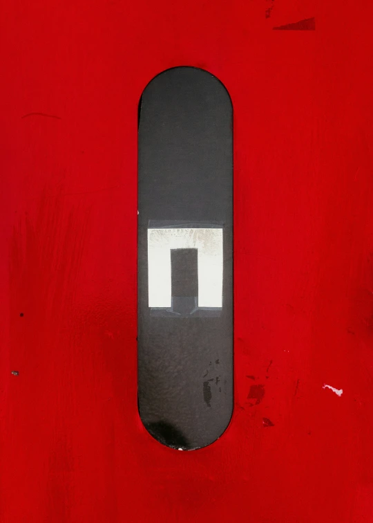 a skateboard that has the letter t painted on it