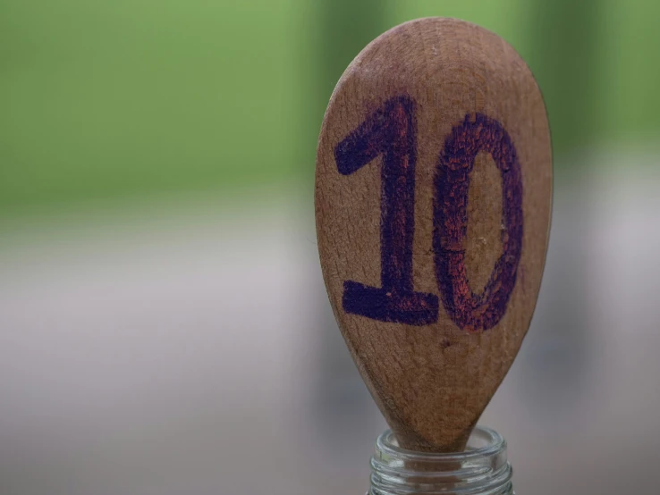 a wooden spoon with a handmade message written on it