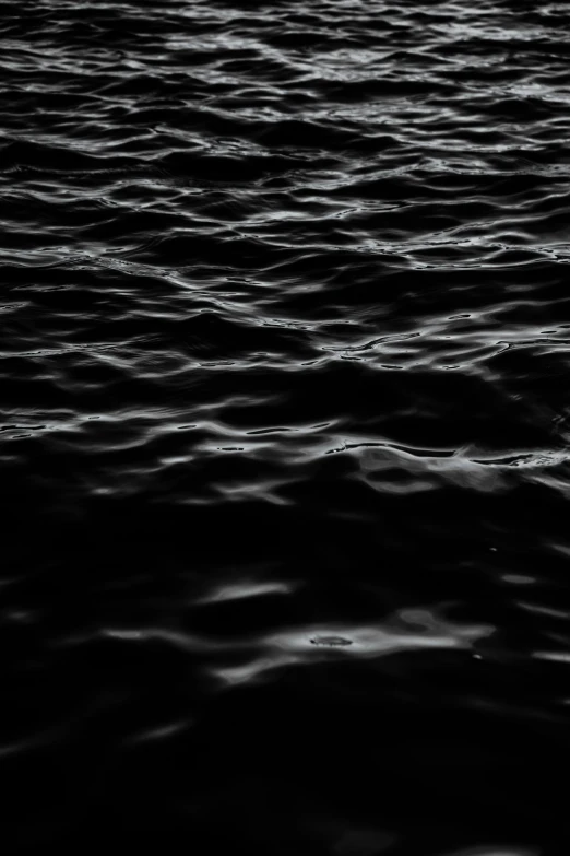 a black and white po of wavy water