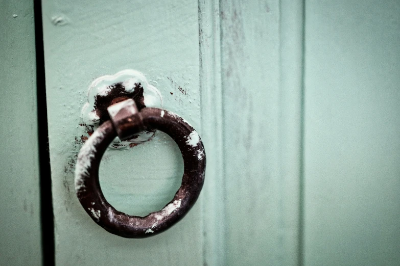 a ring that has snow on it next to a door