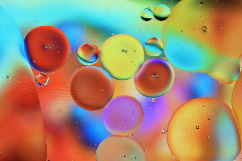 a colorful abstract background with bubbles and drops