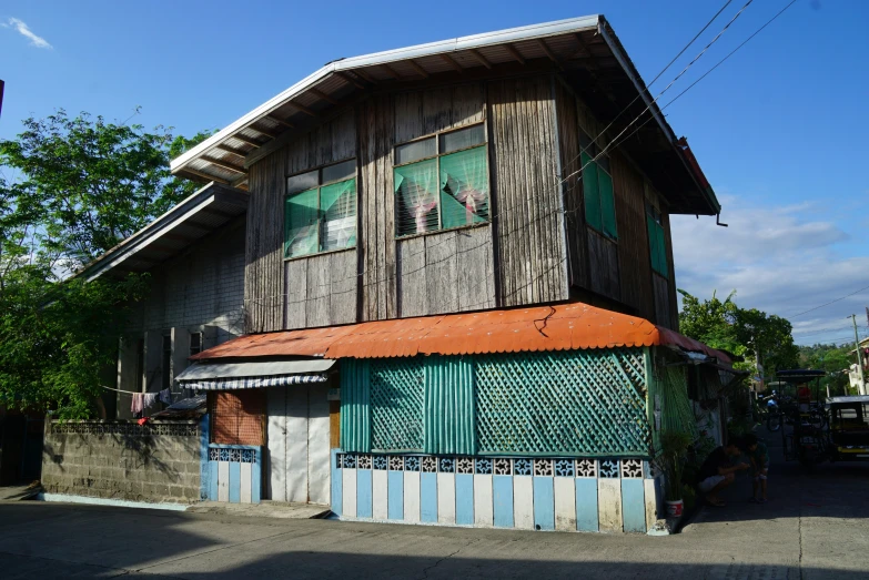 a multicolored building sitting on a street corner