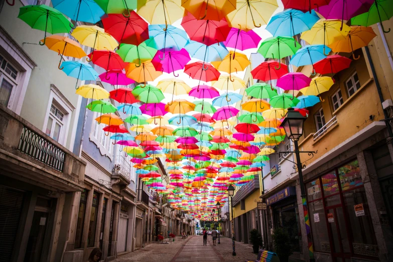 a very big group of umbrellas in the air