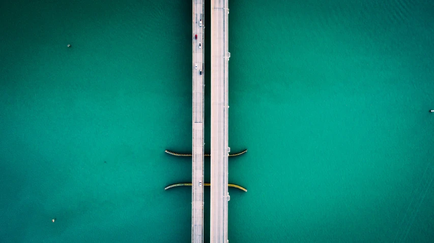 top down view of two boats near the pier
