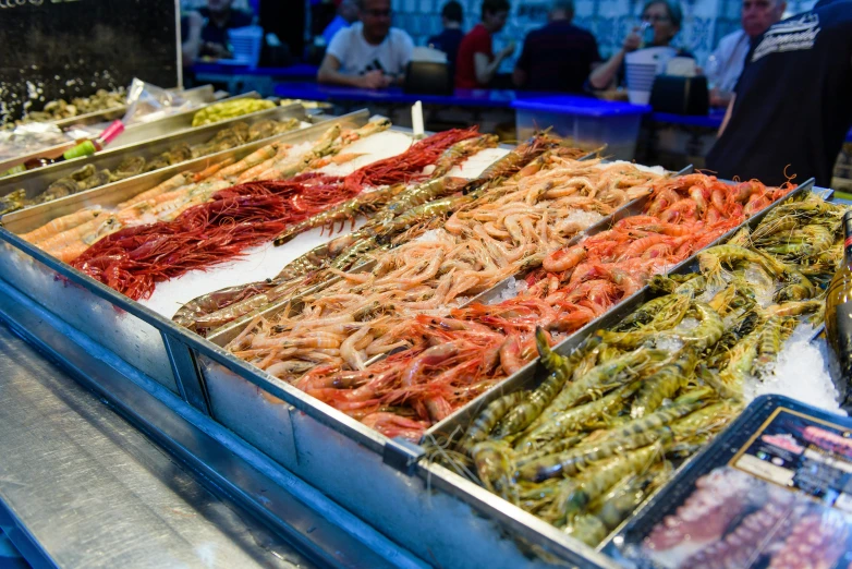 the shrimp and other foods are in different bowls