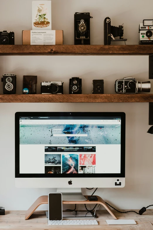 a desktop computer and camera on a desk