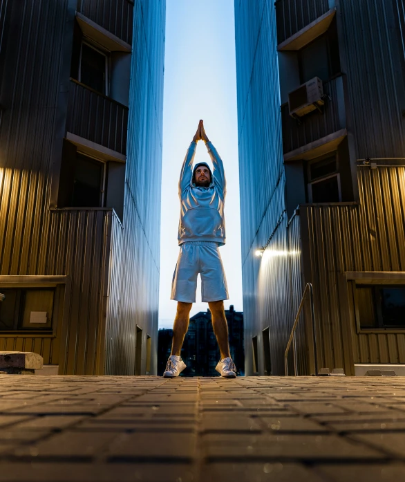 a person standing in front of tall buildings