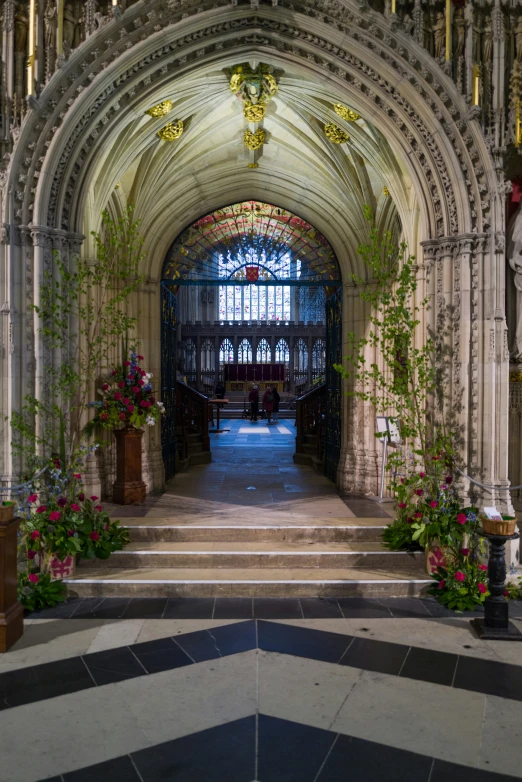 a church with a big arch and stone stairs