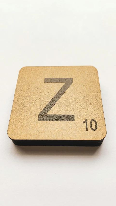 a wooden plate with an image of the letter z