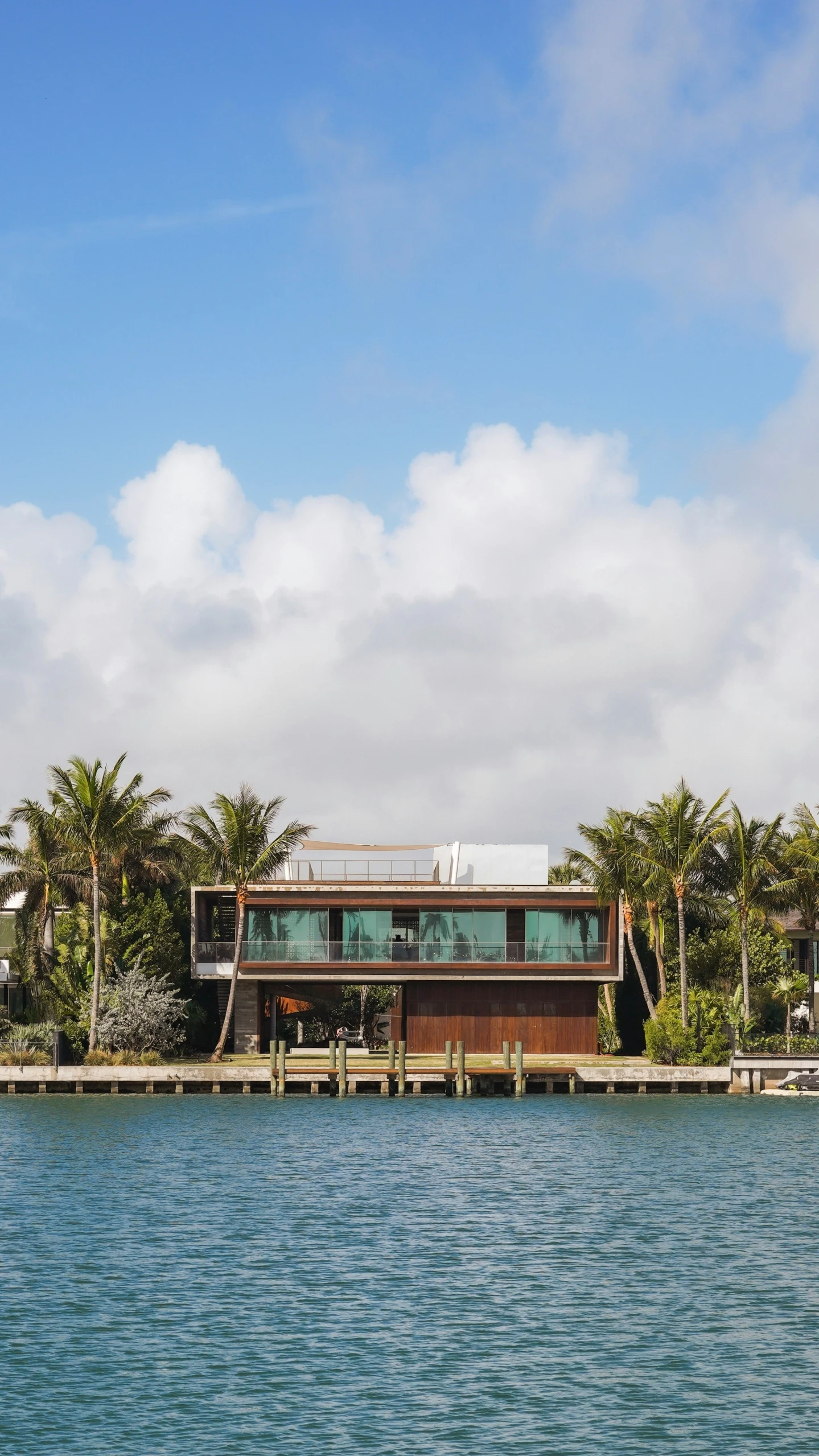 a long building is sitting on top of the water