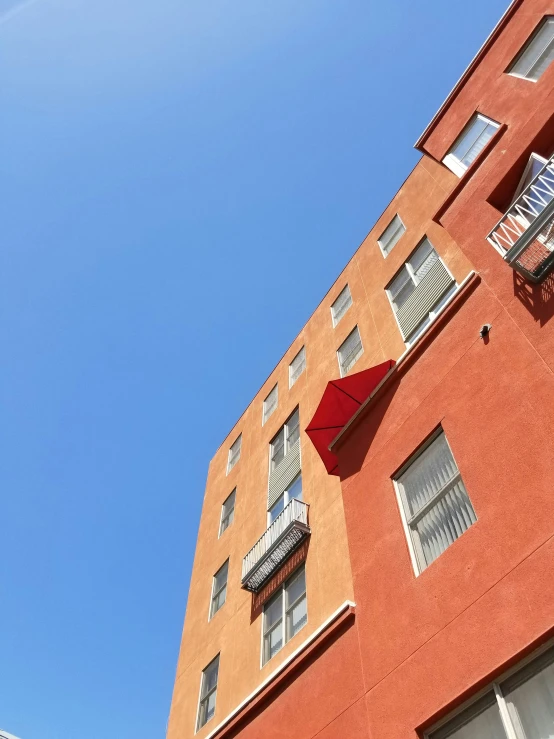 there is a building with several balconies on it