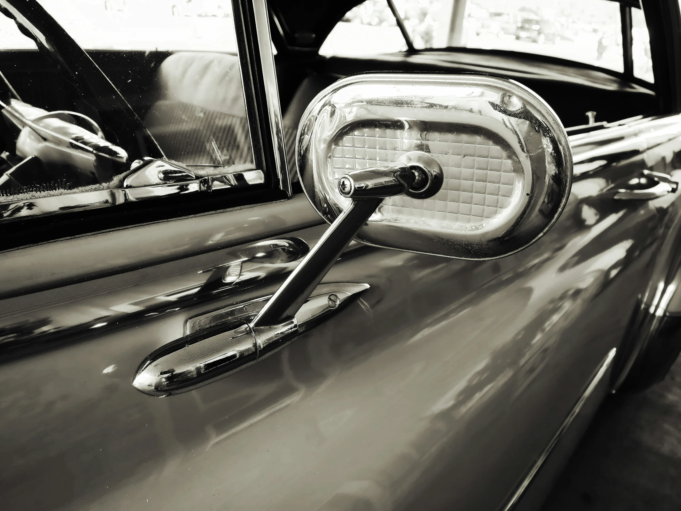 a very close up of the rear mirror on a vintage car