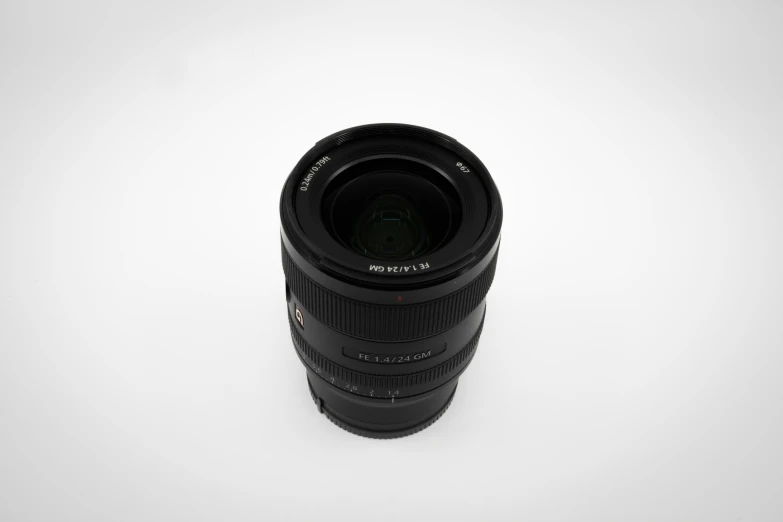 a black camera lens is shown in the white background