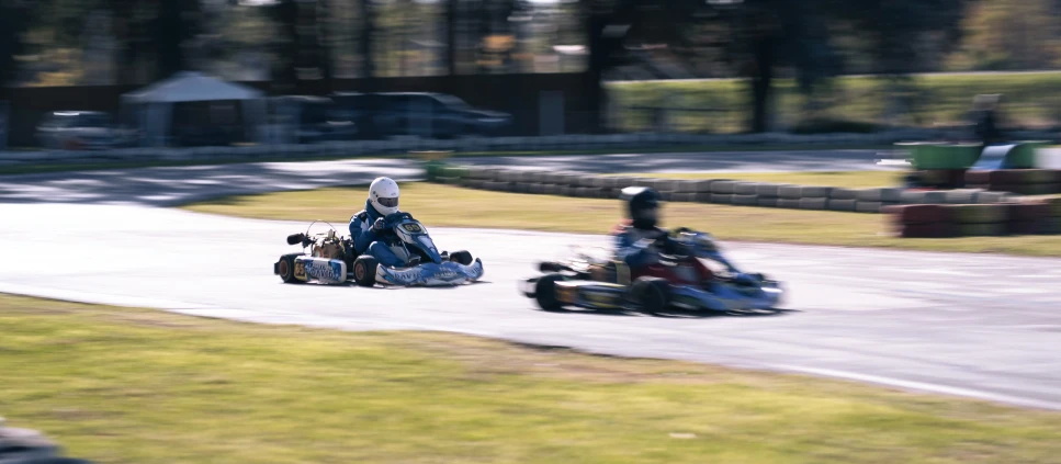 there are two people driving on go kart races