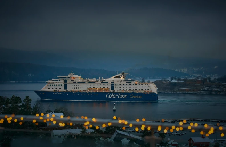 a big cruise ship in the ocean during night