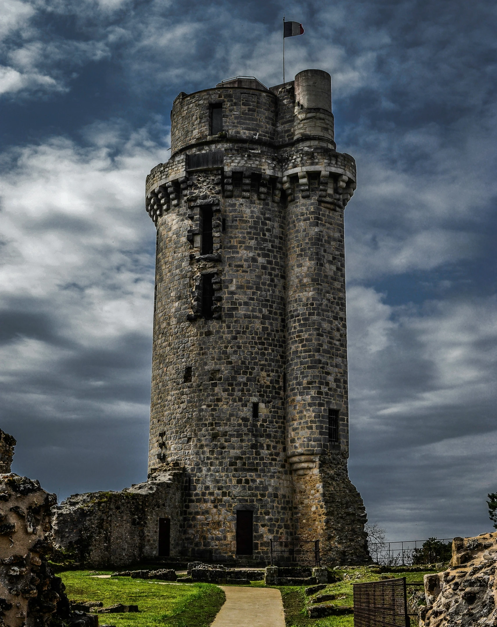 an old castle with a flag on top