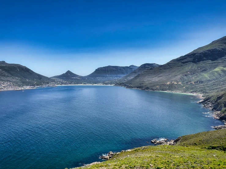 a view from the mountains looking over the water