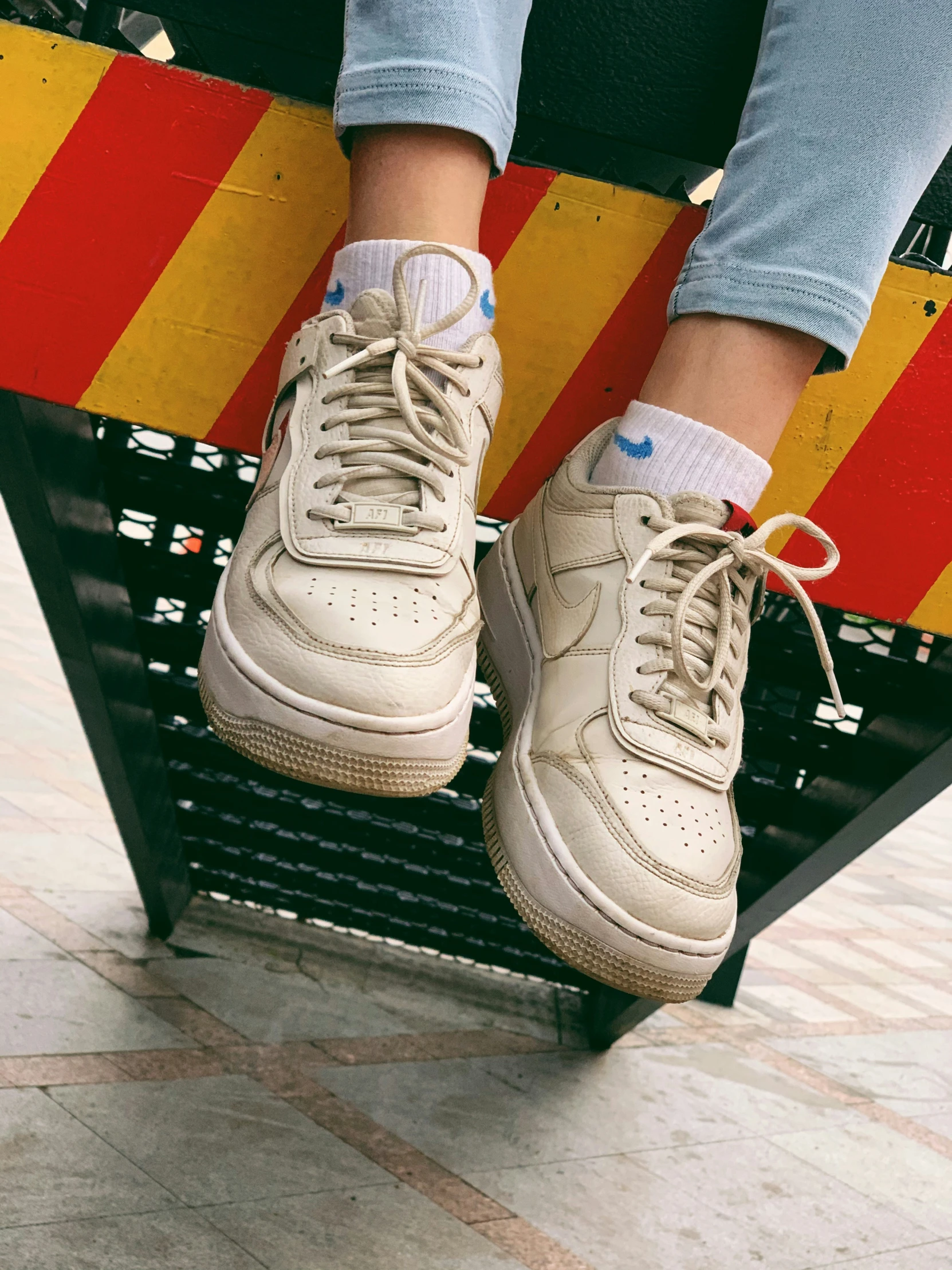 a close up of person's feet on a platform