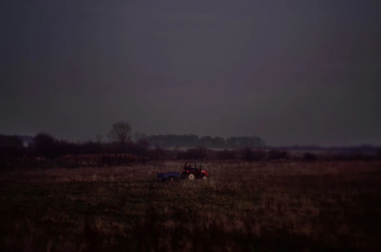 a tractor is sitting in the middle of a field