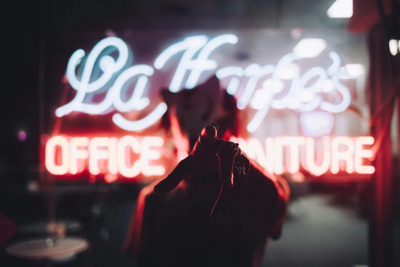 blurred view of the light fixture behind a person taking a po